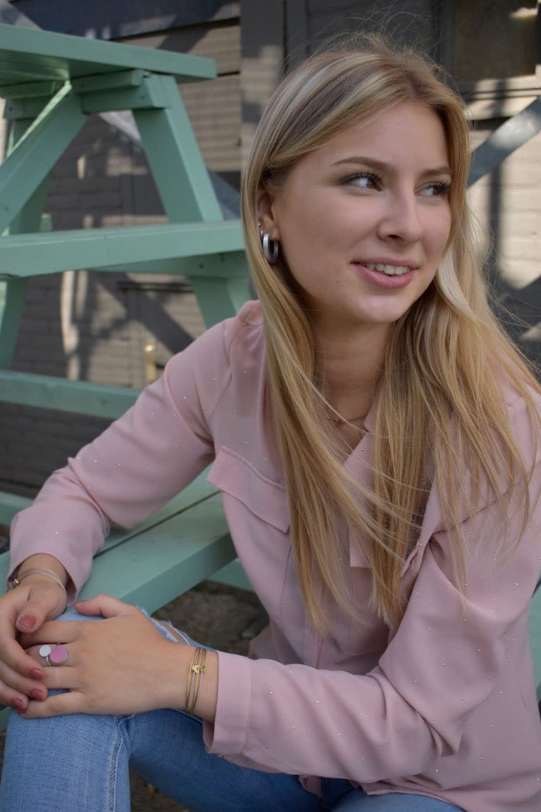 Woman wearing Thinking of You bracelet with gold-tone flower charm | CLIC by Suzanne
